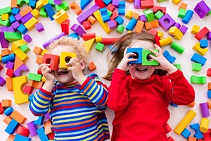 Children playing with colorful building blocks